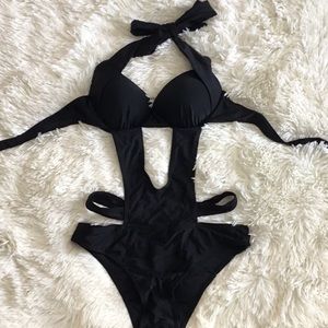 Never worn One piece bathing suit with cut outs